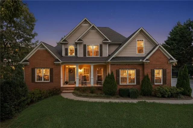 a front view of a house with a yard