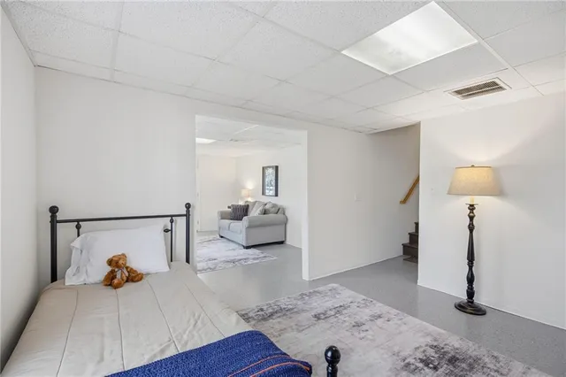 a bed room with a bed and a night stand