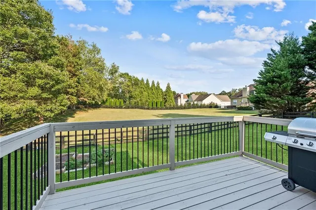a view of deck with wooden floor and fence