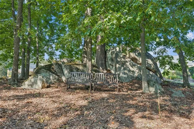 a view of house with a tree