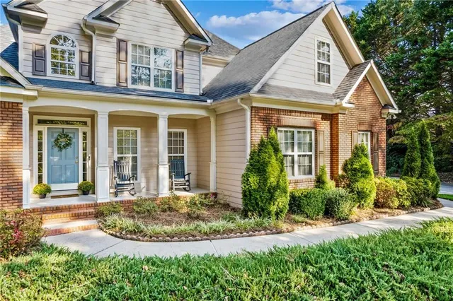 front view of a house with a yard