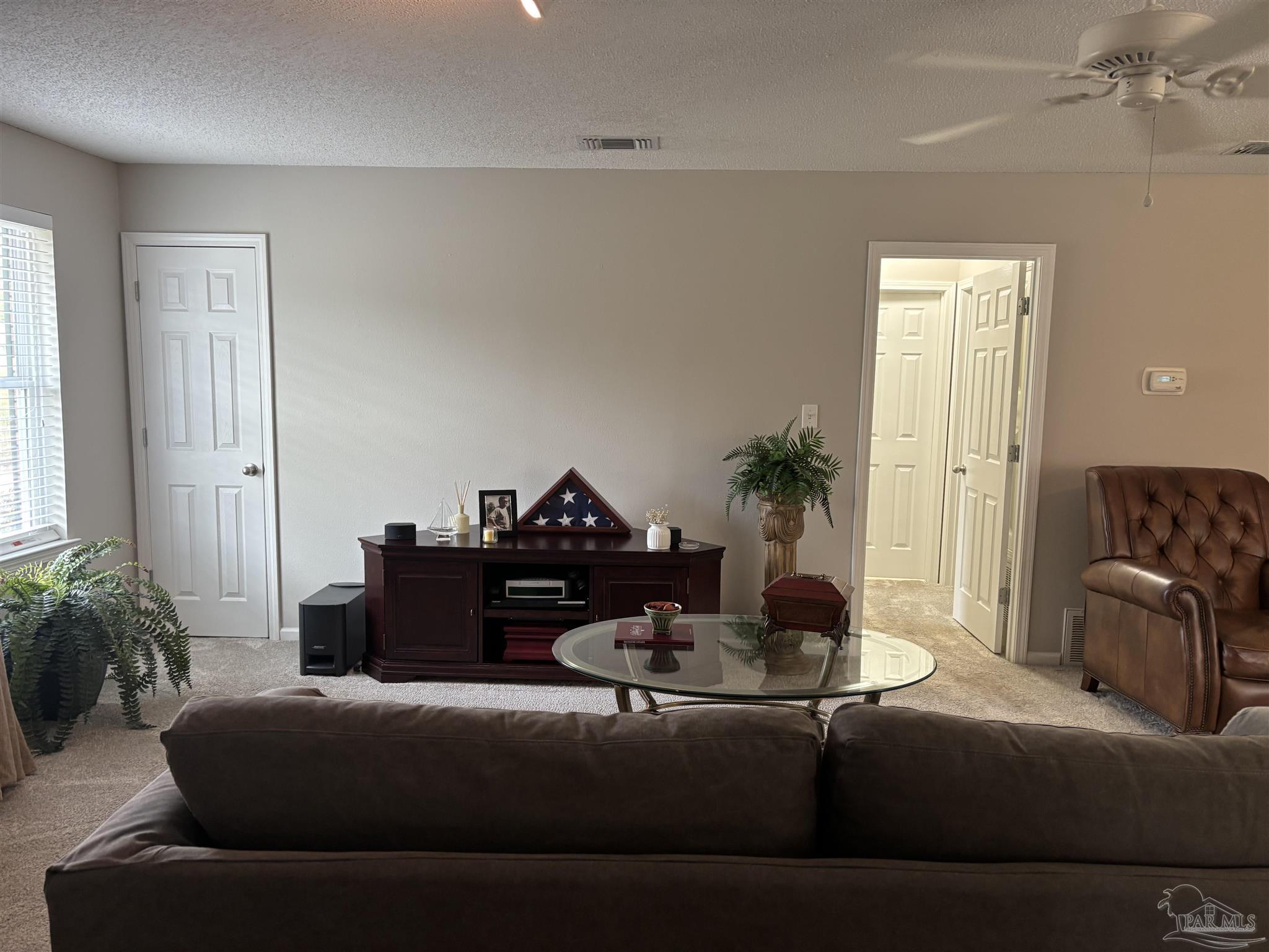 5367 Constitution Road Crestview, FL 32539 - Photo 16 of 29 a living room with furniture and a potted plant