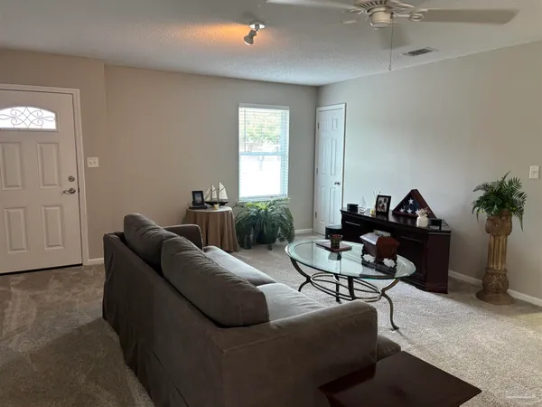 a living room with furniture and a window