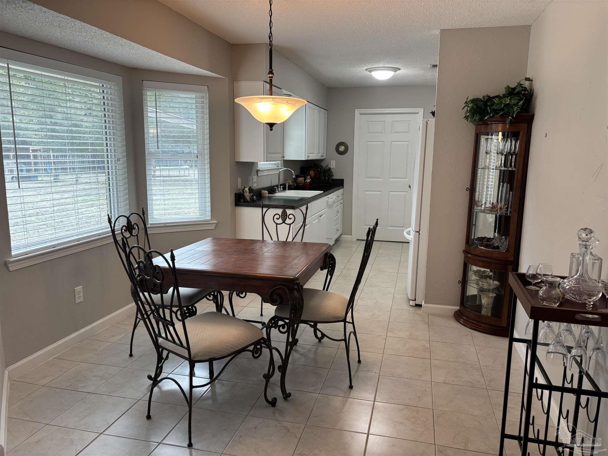 5367 Constitution Road Crestview, FL 32539 - Photo 19 of 29 a view of a dining room with furniture