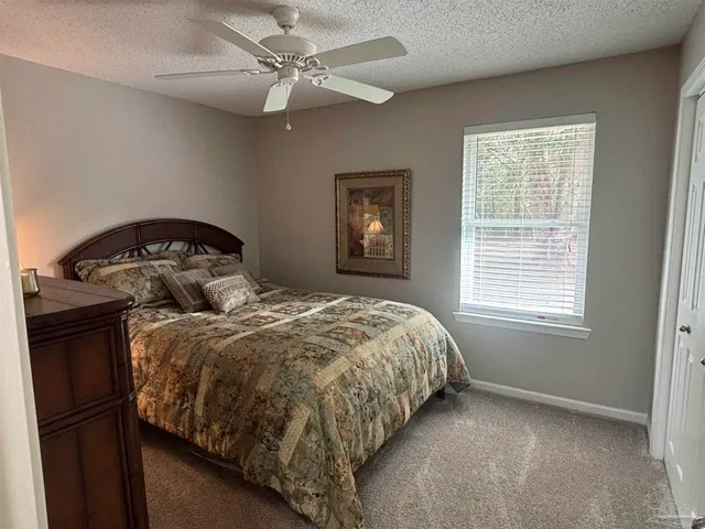 a bedroom with two beds and a window