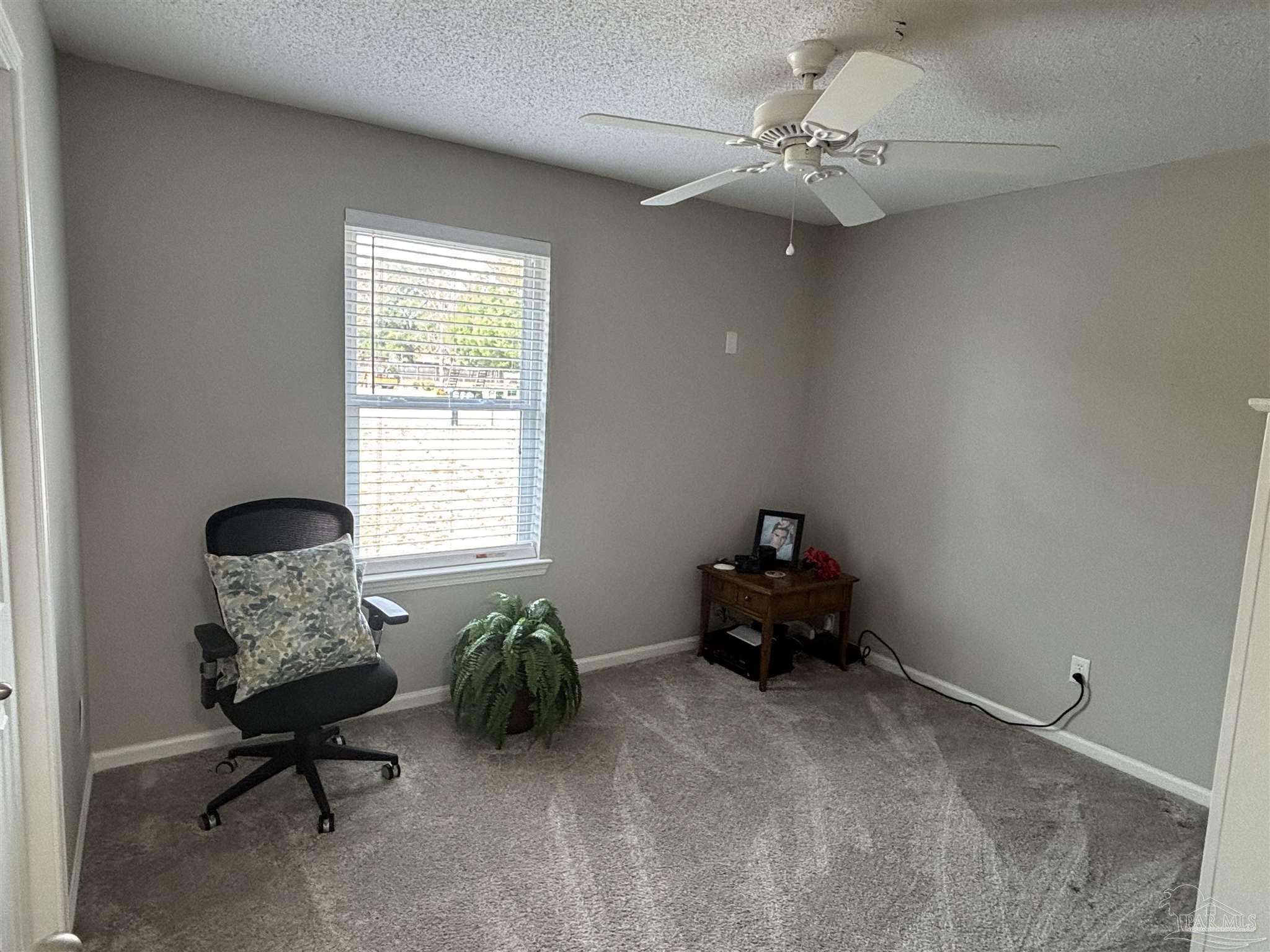 5367 Constitution Road Crestview, FL 32539 - Photo 26 of 29 a living room with furniture and a window
