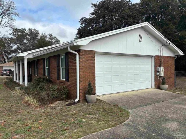 a front view of a house with garage