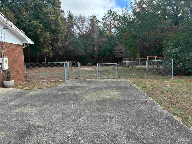 a backyard of a house with lots of green space