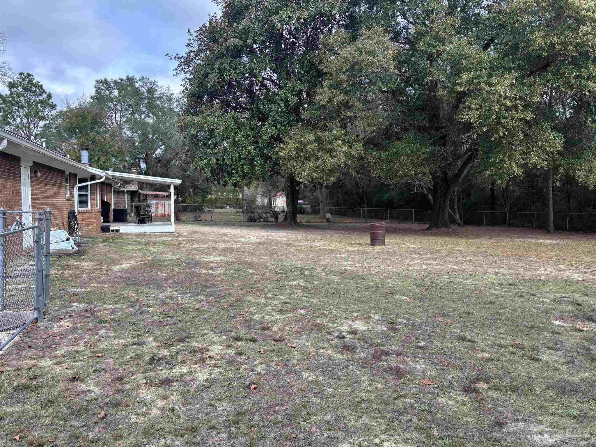5367 Constitution Road Crestview, FL 32539 - Photo 5 of 29 a view of outdoor space with deck and trees