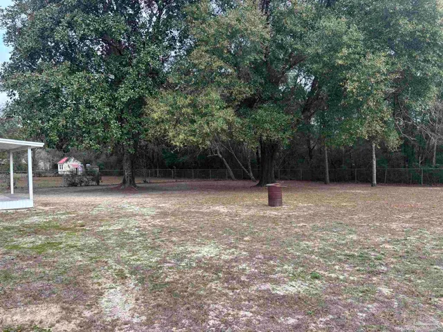 a backyard of a house with lots of green space
