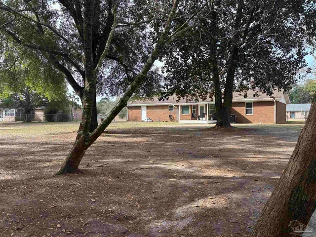 a house with trees in front of it