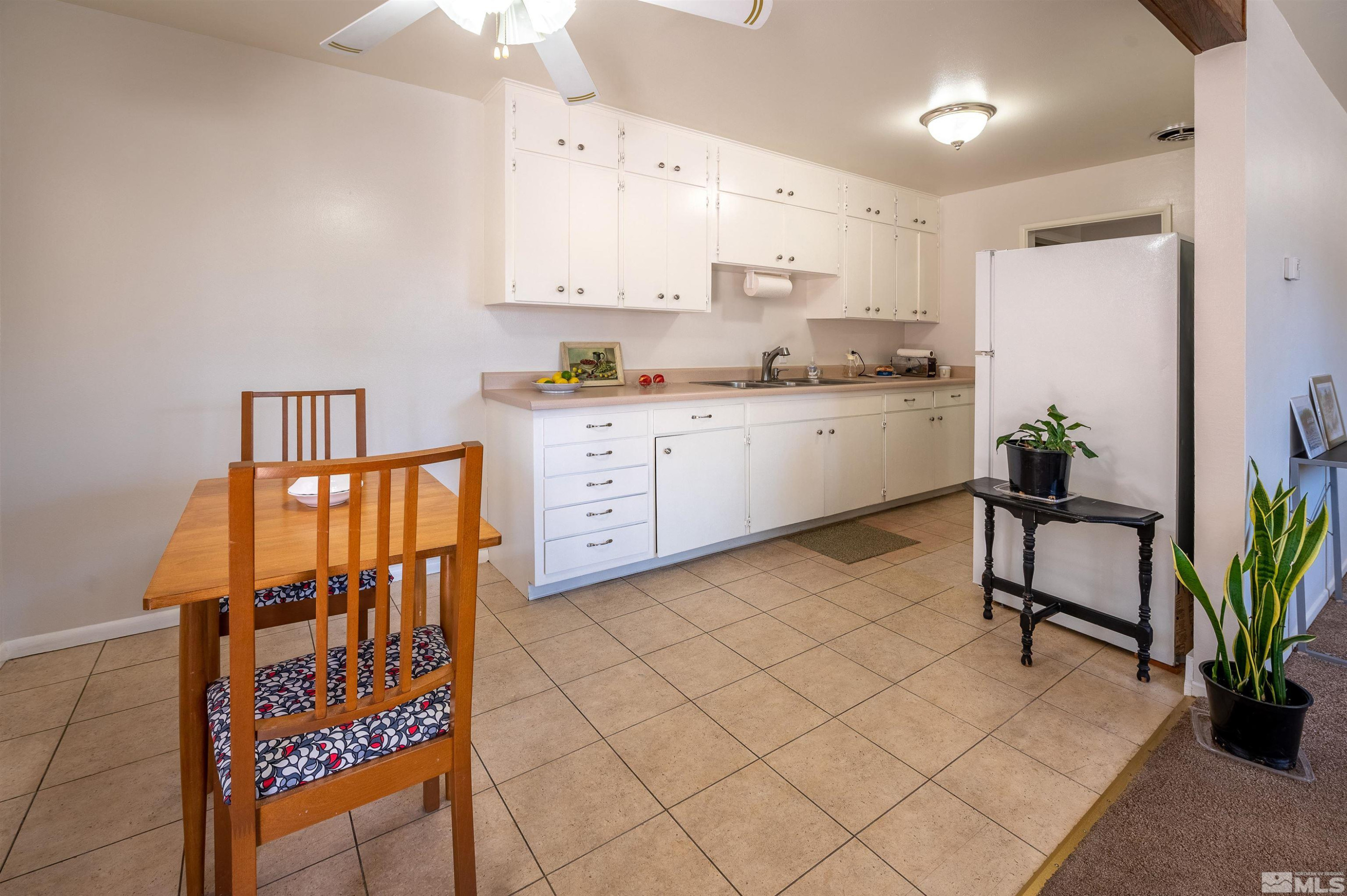 282 Mt Rose Street Reno, NV 89509 - Photo 12 of 22 a kitchen with stainless steel appliances a refrigerator sink and cabinets