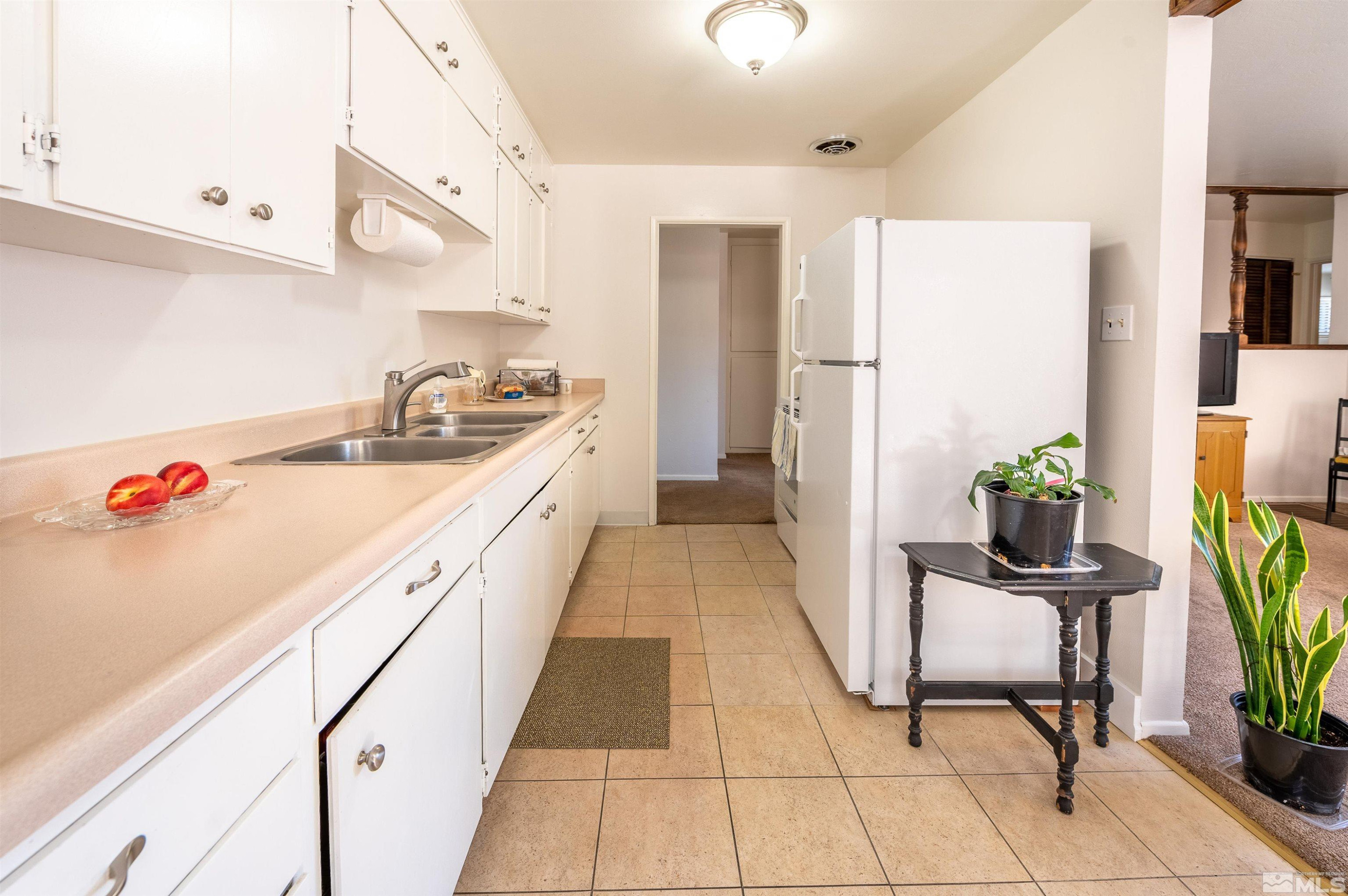 282 Mt Rose Street Reno, NV 89509 - Photo 13 of 22 a kitchen with a sink appliances and cabinets