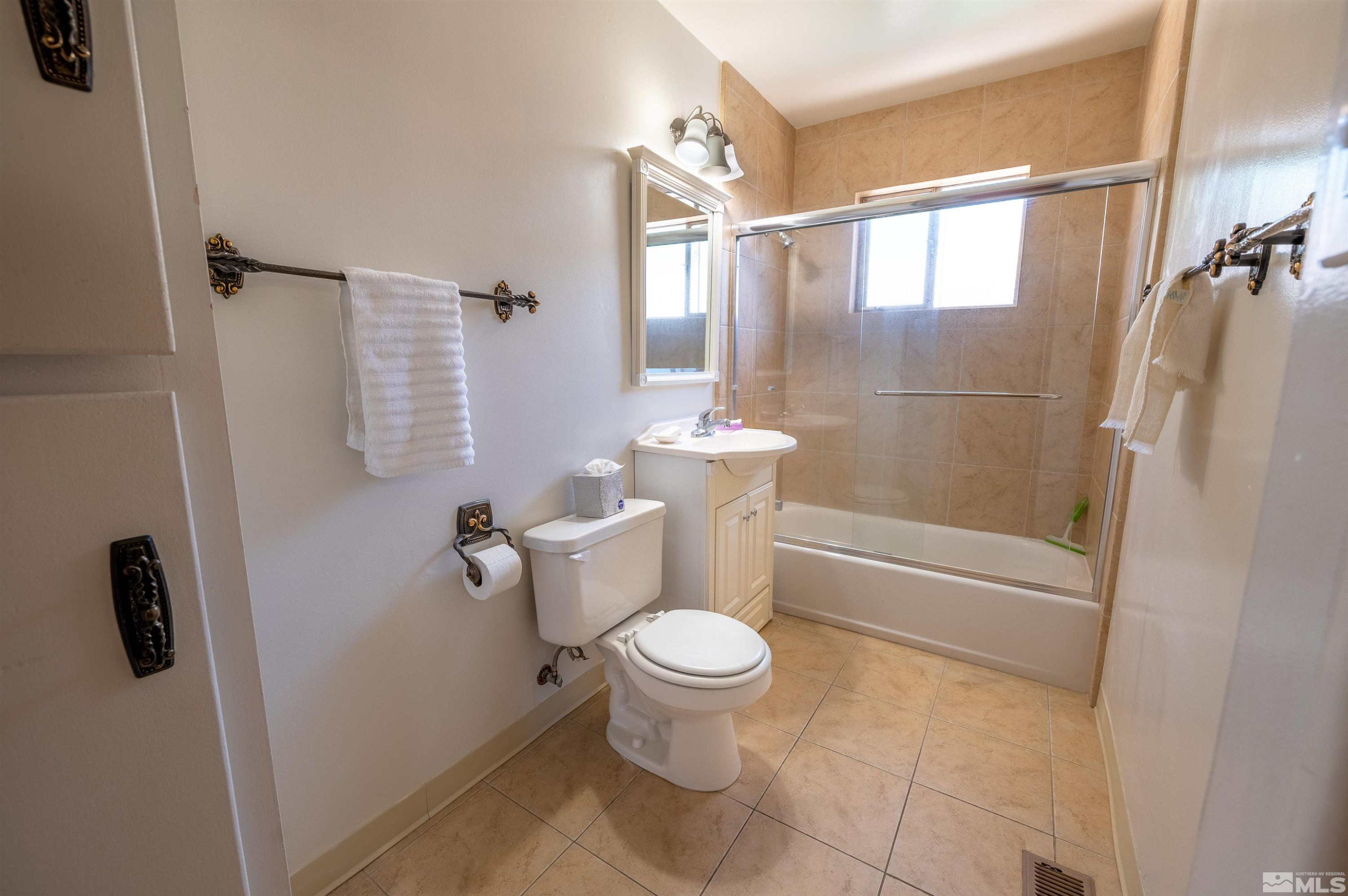 282 Mt Rose Street Reno, NV 89509 - Photo 14 of 22 a bathroom with a toilet and a shower