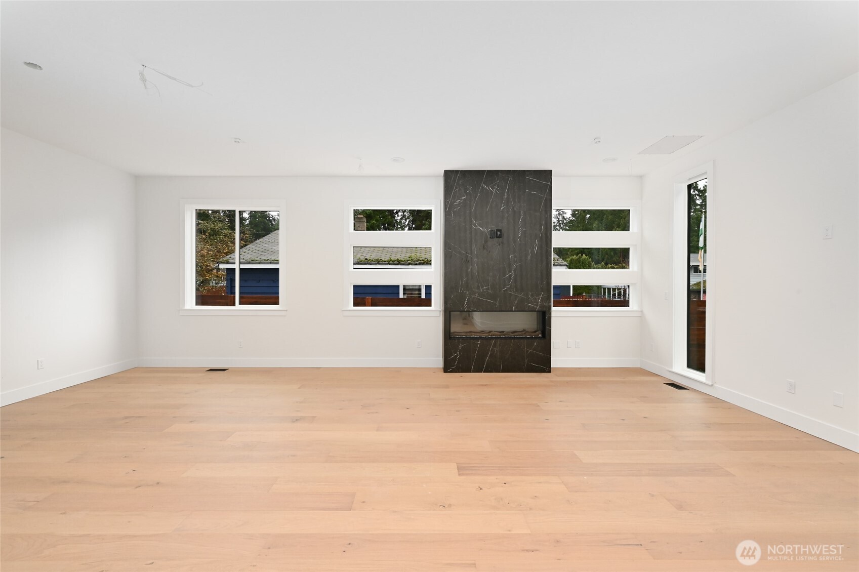 17526 Fremont Avenue North Shoreline, WA 98133 - Photo 16 of 40 a view of empty room with large windows
