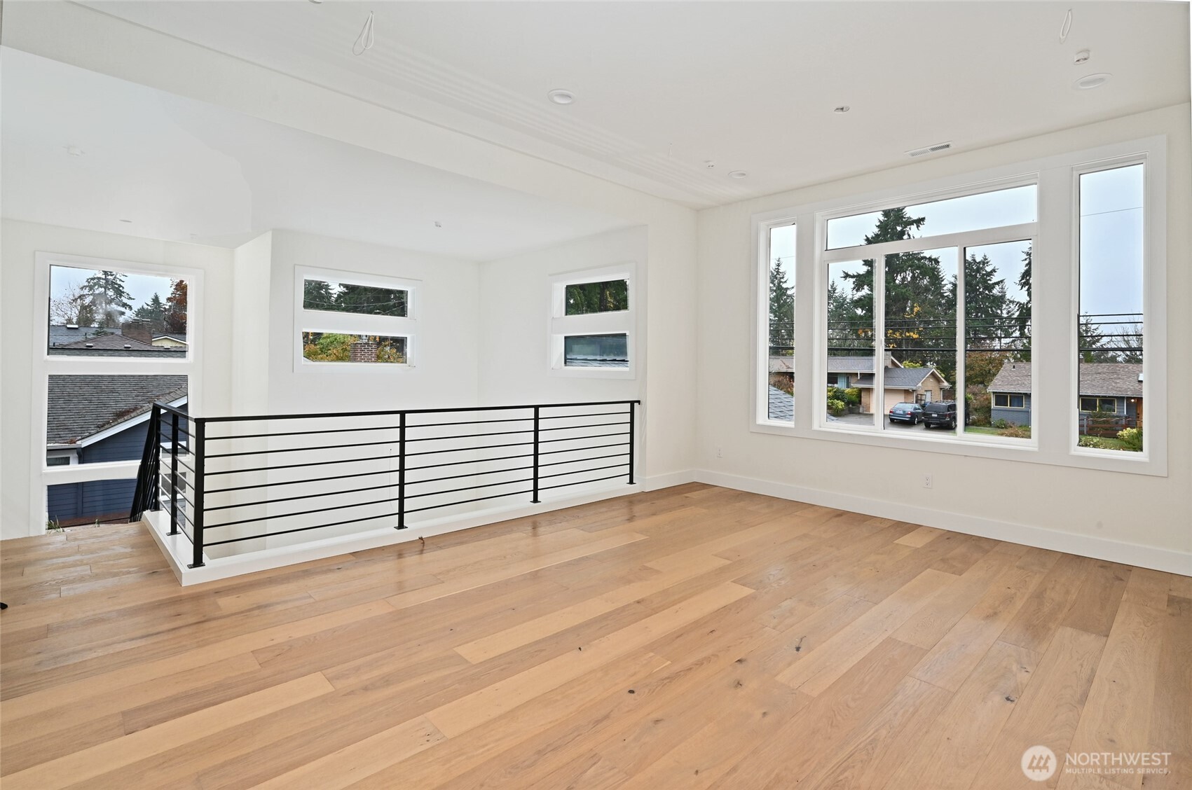 17526 Fremont Avenue North Shoreline, WA 98133 - Photo 26 of 40 a view of a livingroom with wooden floor and a window