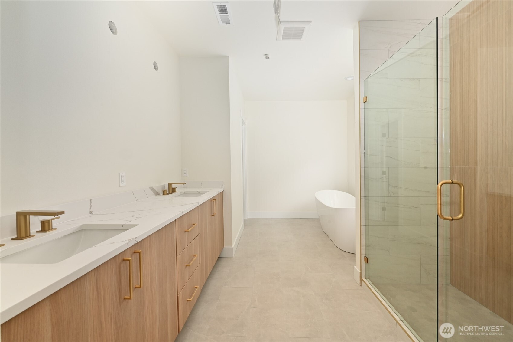 17526 Fremont Avenue North Shoreline, WA 98133 - Photo 31 of 40 a bathroom with a double vanity sink and a toilet