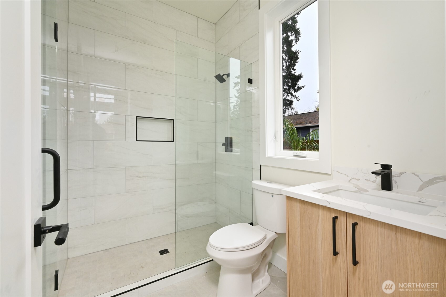 17526 Fremont Avenue North Shoreline, WA 98133 - Photo 6 of 40 a bathroom with a granite countertop sink toilet and shower