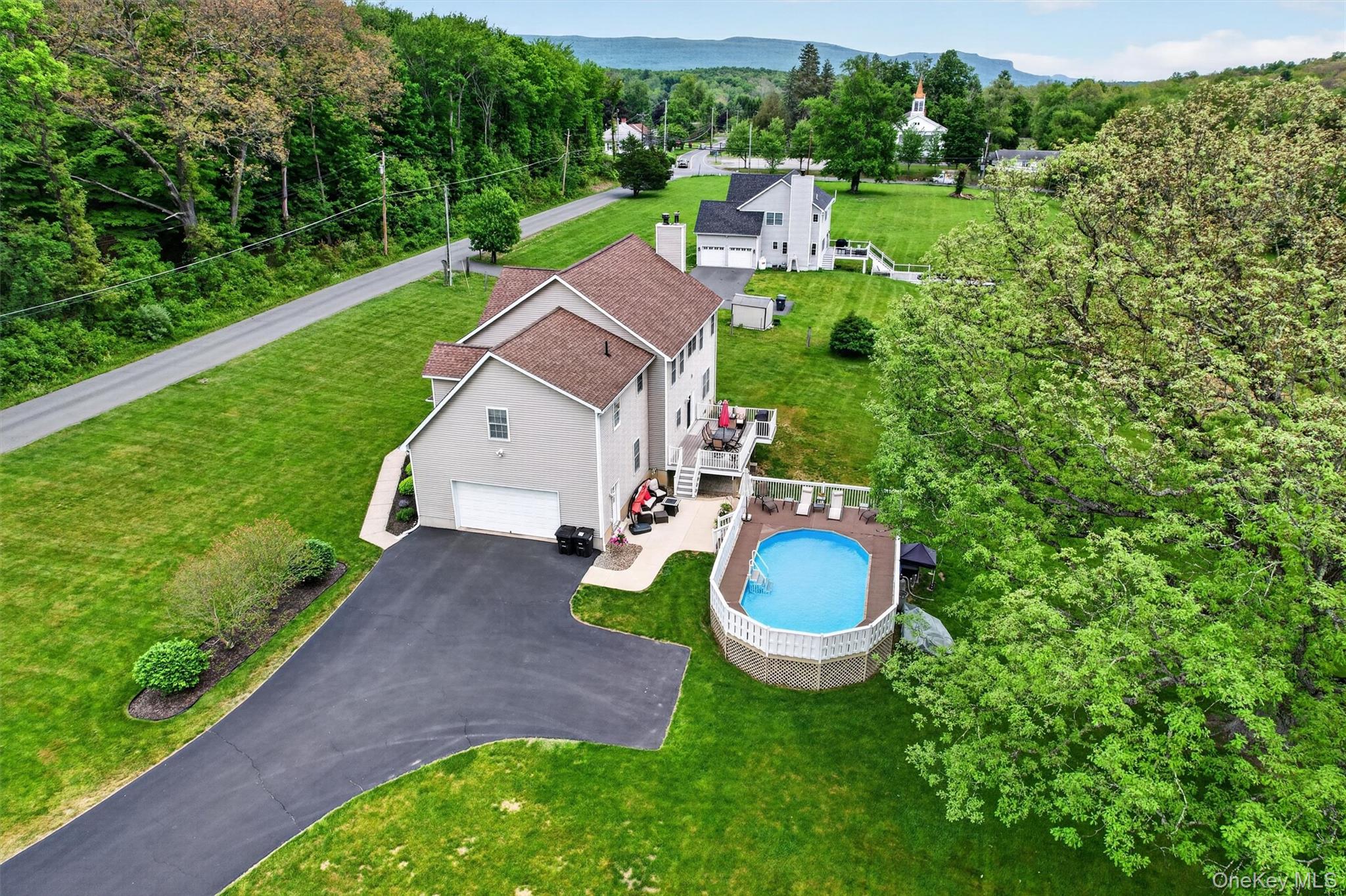 19 Pirog Road Pine Bush, NY 12566 - Photo 45 of 50 a aerial view of a house with swimming pool and garden