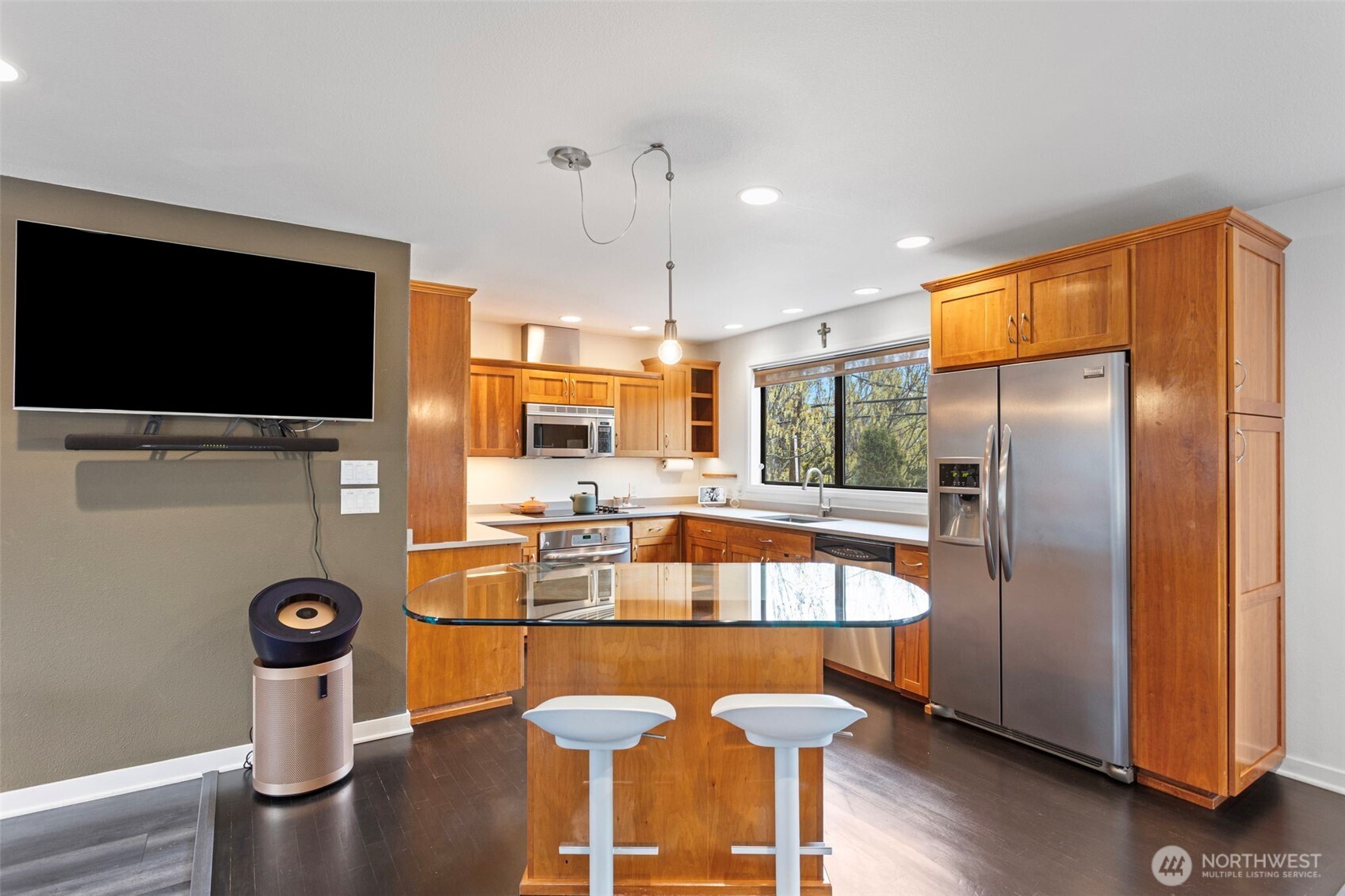 611 State Street, Unit 9 Kirkland, WA 98033 - Photo 12 of 36 a kitchen with stainless steel appliances granite countertop a sink a stove and a refrigerator