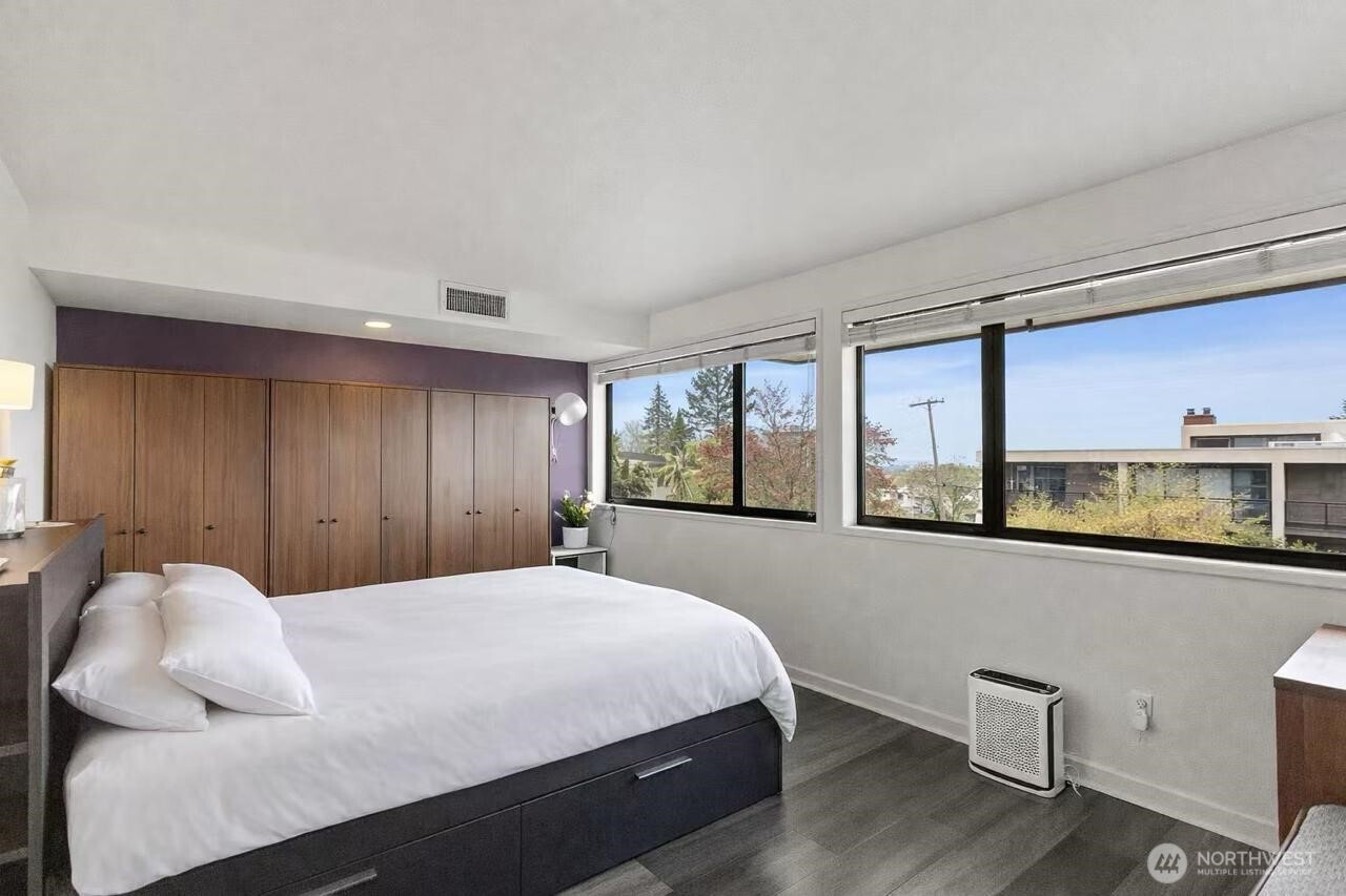 611 State Street, Unit 9 Kirkland, WA 98033 - Photo 20 of 36 a bedroom with a large bed and windows