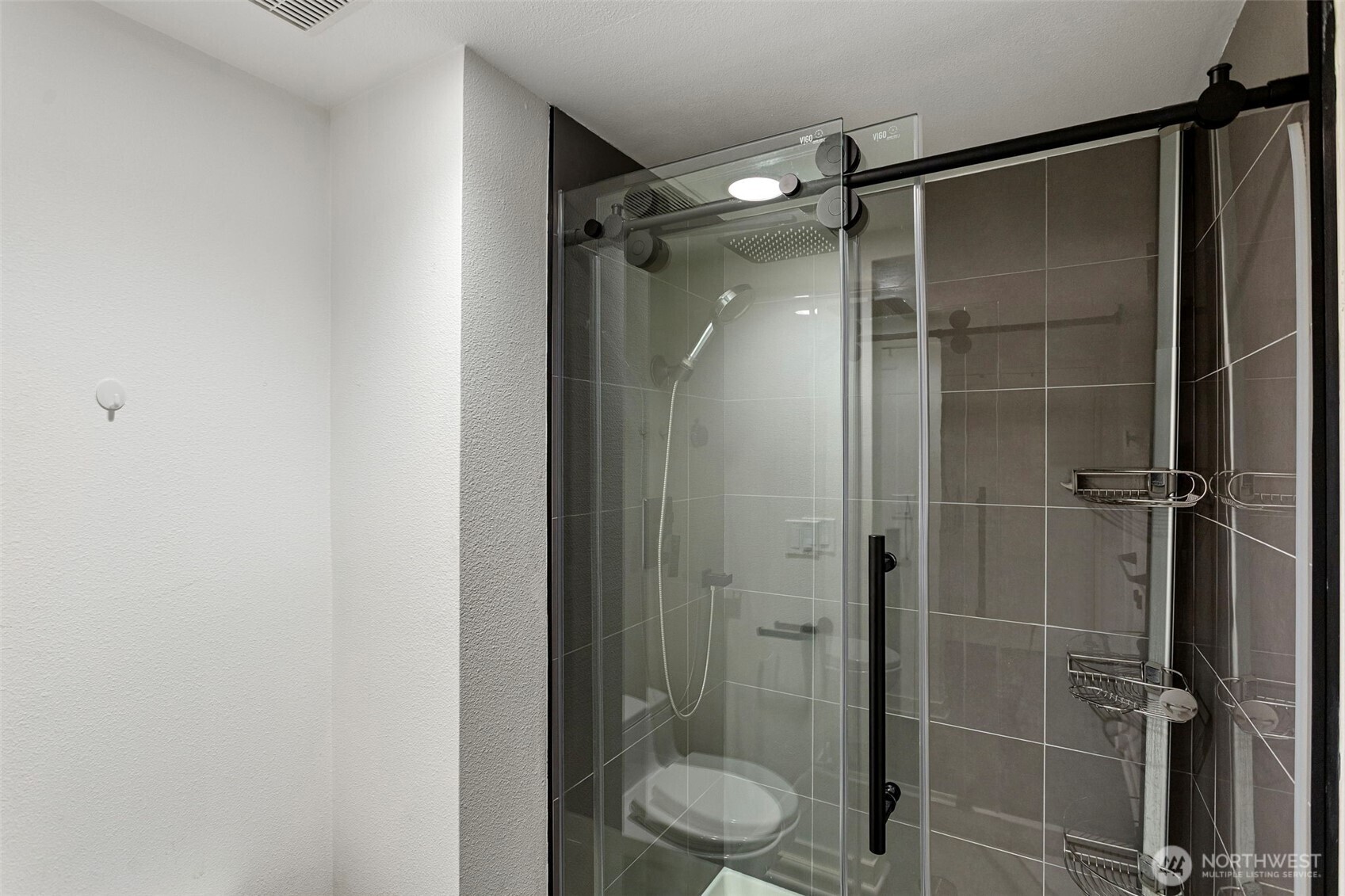 611 State Street, Unit 9 Kirkland, WA 98033 - Photo 22 of 36 a bathroom with a shower and a toilet