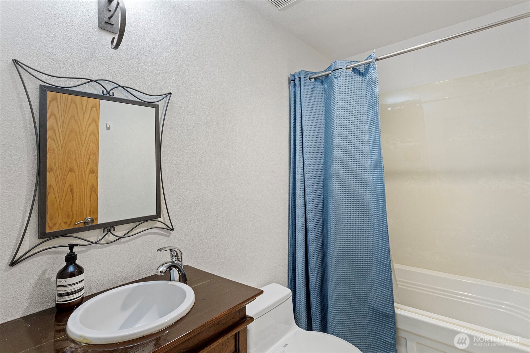 611 State Street, Unit 9 Kirkland, WA 98033 - Photo 23 of 36 a bathroom with a sink a toilet and shower