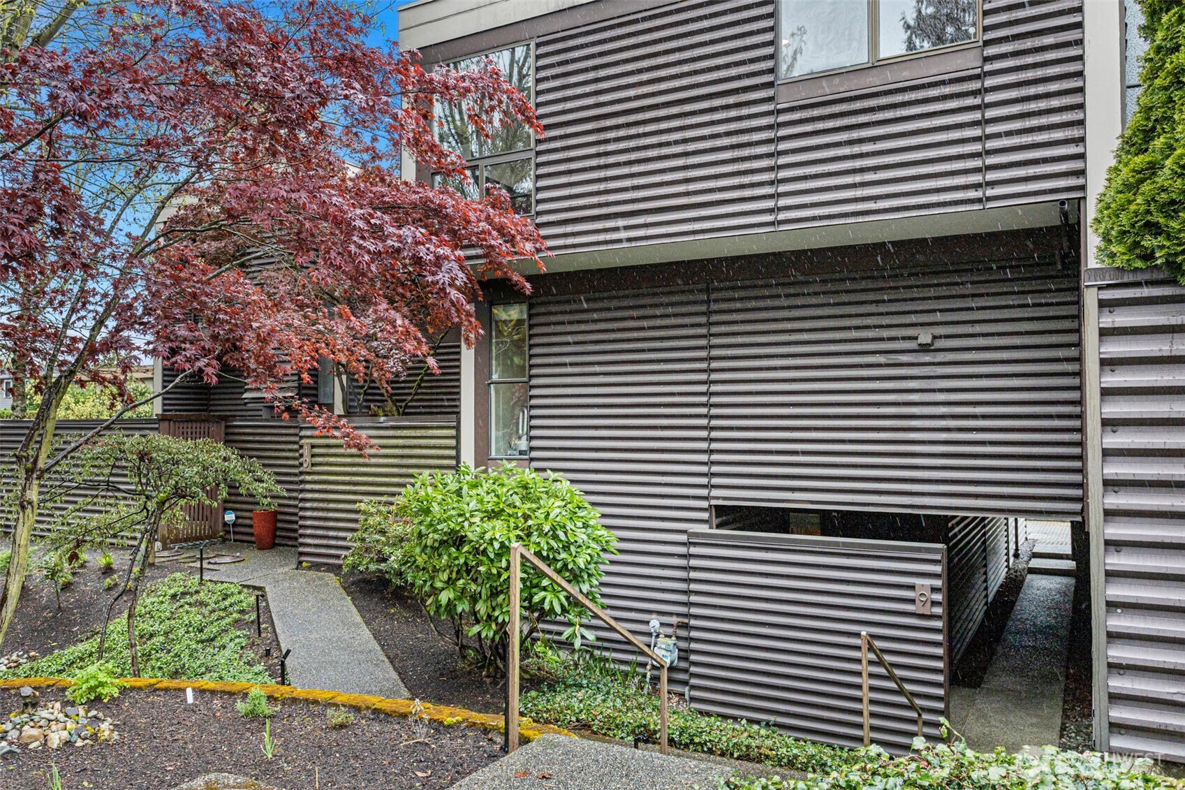 611 State Street, Unit 9 Kirkland, WA 98033 - Photo 29 of 36 a view of a house with a yard and a tree