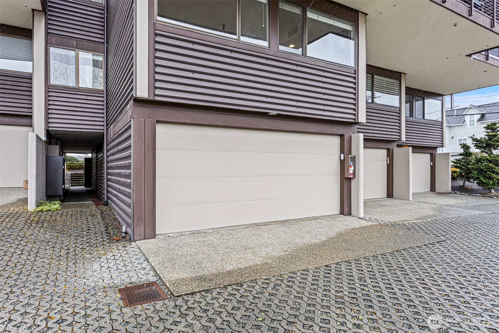 611 State Street, Unit 9 Kirkland, WA 98033 - Photo 30 of 36 a view of a house with a door and a garage