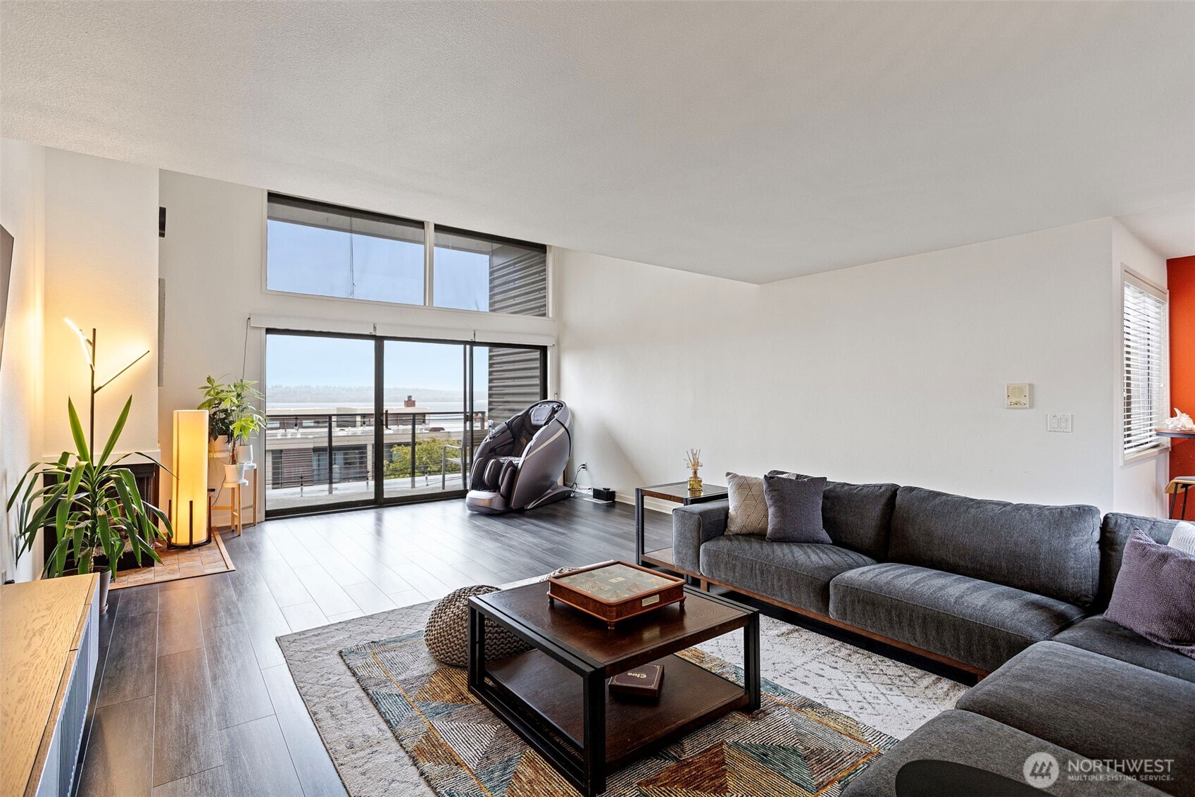611 State Street, Unit 9 Kirkland, WA 98033 - Photo 5 of 36 a living room with furniture and a floor to ceiling window