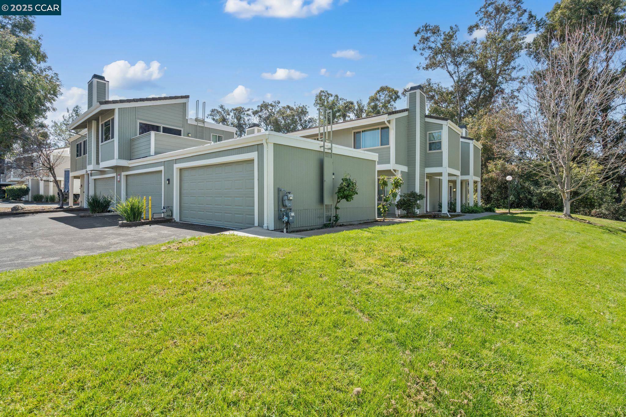 220 Apollo, Unit 5 Hercules, CA 94547 - Photo 1 of 1 a front view of a house with a yard