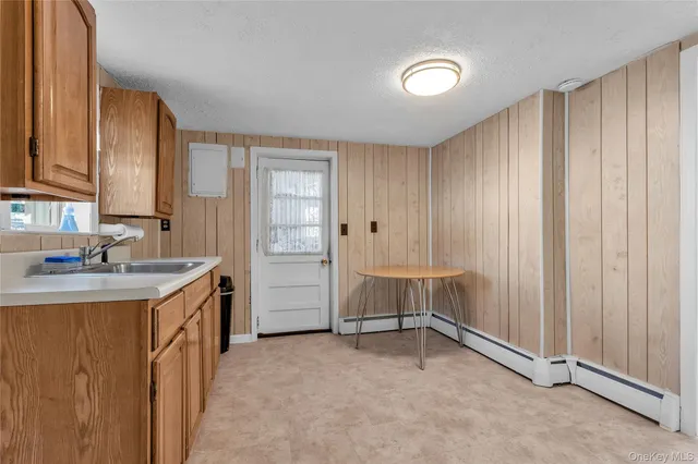 a view of a kitchen with cabinets
