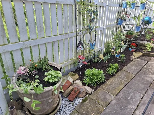 a garden with flowers in front of it
