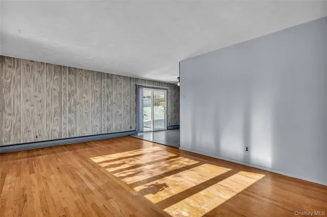 a view of a room with a wooden floor
