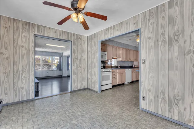 a view of a kitchen with a sink and cabinet area