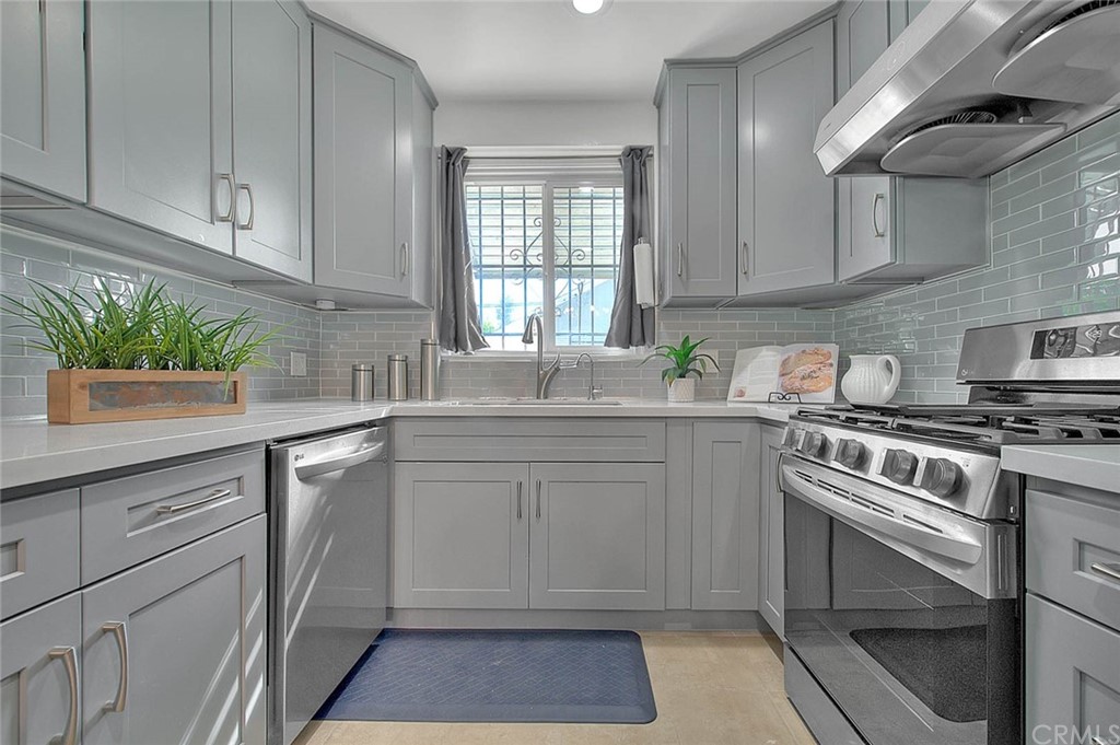2509 Pine Valley Drive Alhambra, CA 91803 - Photo 18 of 63 a kitchen with granite countertop a sink stainless steel appliances and cabinets
