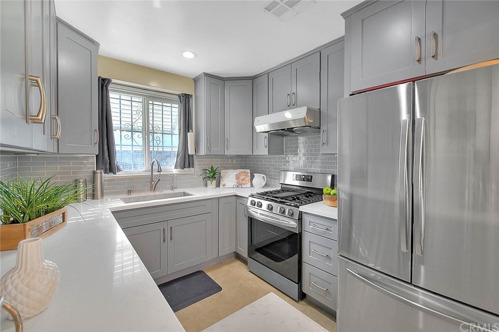 2509 Pine Valley Drive Alhambra, CA 91803 - Photo 23 of 63 a kitchen with stainless steel appliances a stove a sink and a refrigerator