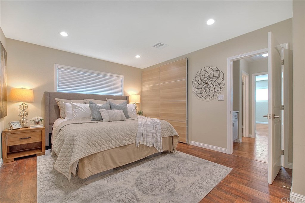 2509 Pine Valley Drive Alhambra, CA 91803 - Photo 30 of 63 a spacious bedroom with a bed and wooden floor