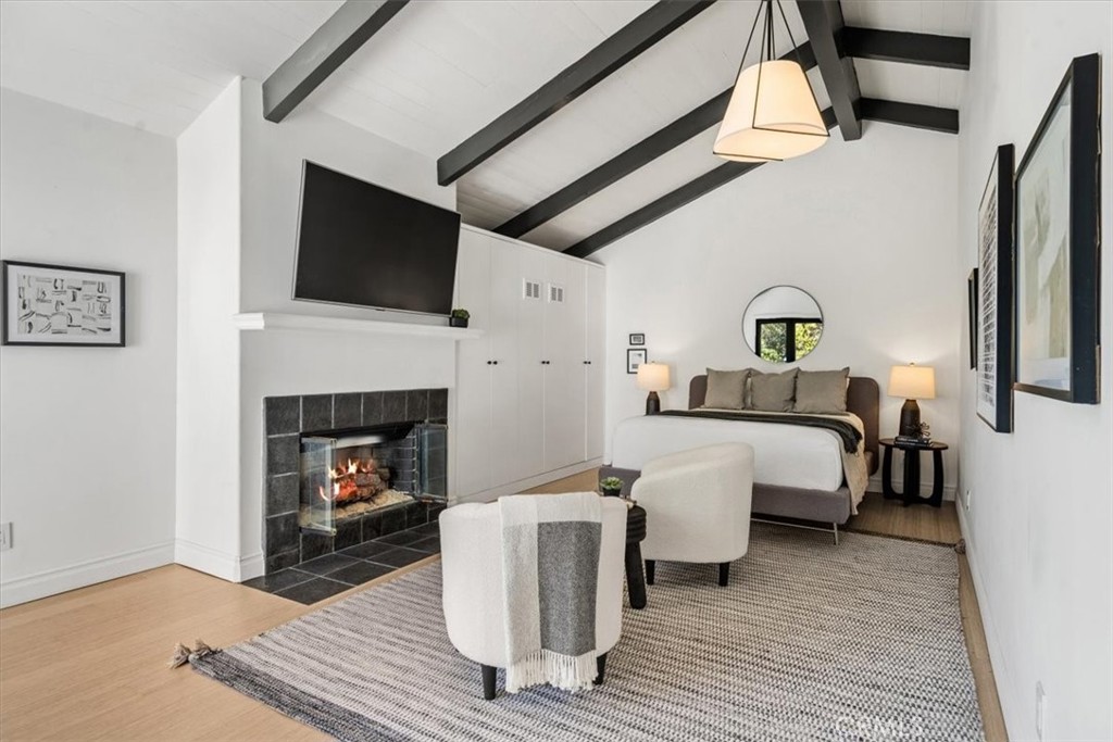 19 Wideloop Road Rolling Hills, CA 90274 - Photo 13 of 35 a living room with furniture and a fireplace