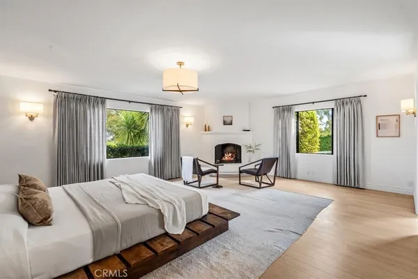 a bedroom with furniture and a window