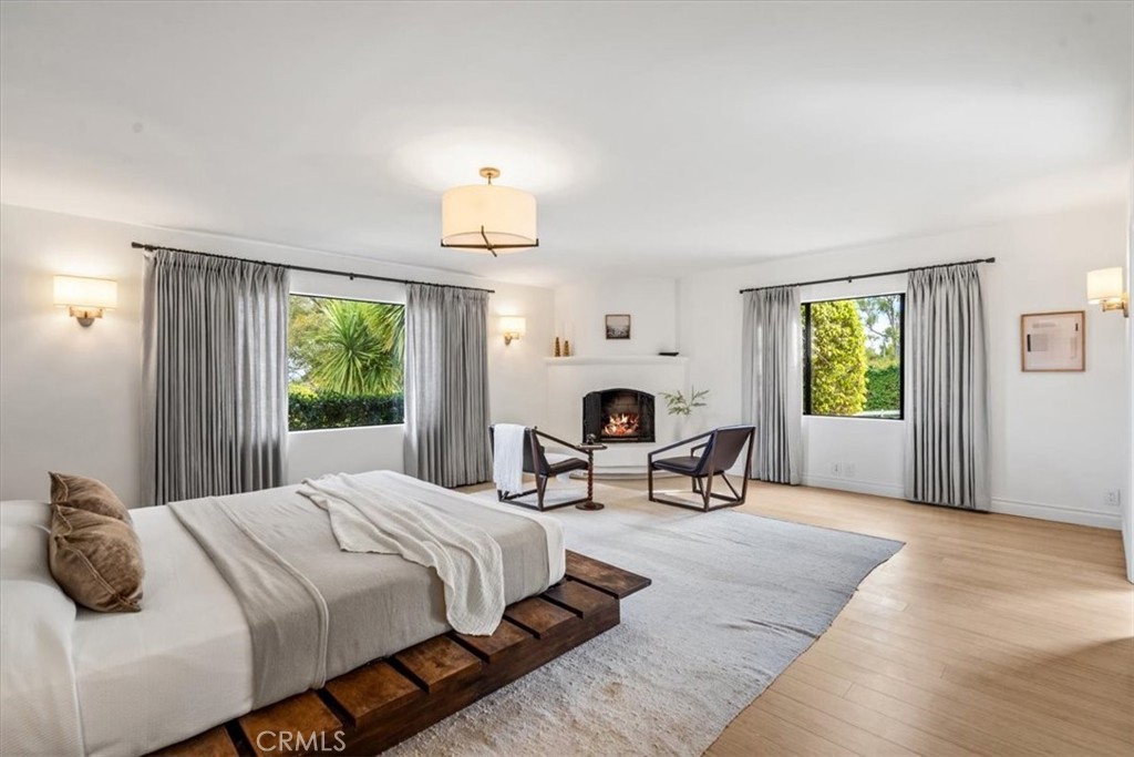 19 Wideloop Road Rolling Hills, CA 90274 - Photo 14 of 35 a bedroom with furniture and a window