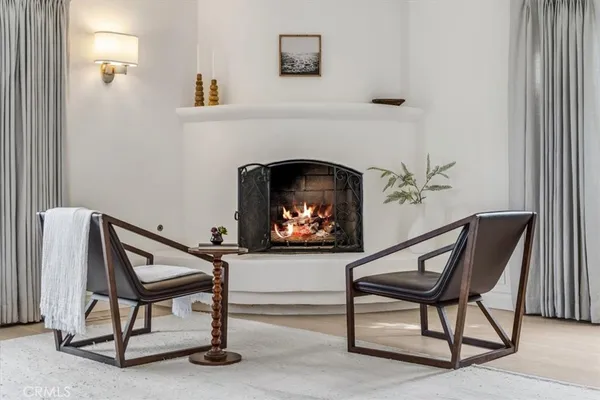 a living room with a furniture and a fireplace