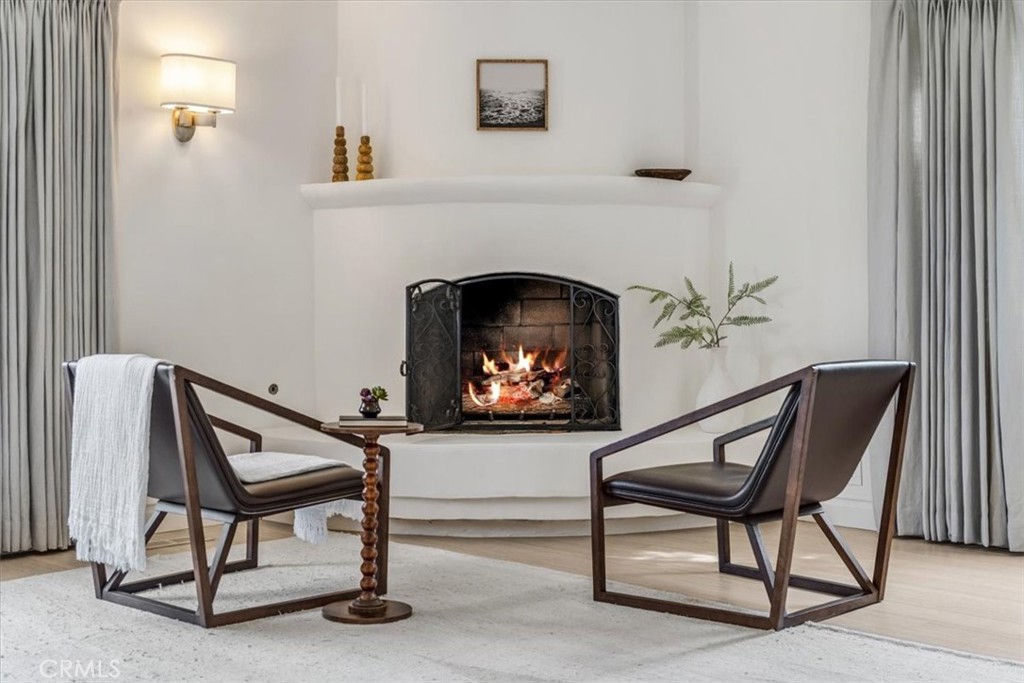 19 Wideloop Road Rolling Hills, CA 90274 - Photo 16 of 35 a living room with a furniture and a fireplace