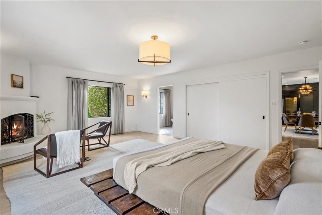 19 Wideloop Road Rolling Hills, CA 90274 - Photo 18 of 35 a bedroom with furniture and a fireplace