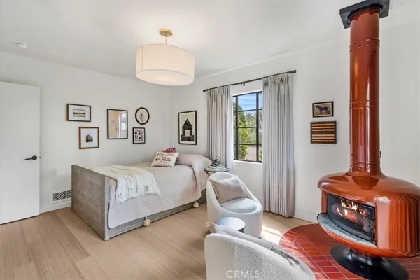 a spacious bedroom with a bed and a window