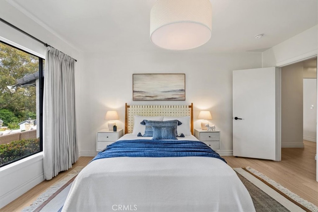 19 Wideloop Road Rolling Hills, CA 90274 - Photo 23 of 35 a view of a bedroom with wooden floor and a window