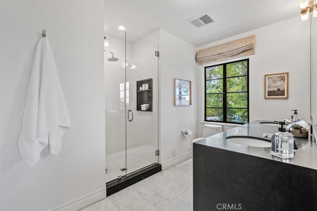 19 Wideloop Road Rolling Hills, CA 90274 - Photo 24 of 35 a spacious bathroom with a double vanity sink a mirror and a shower