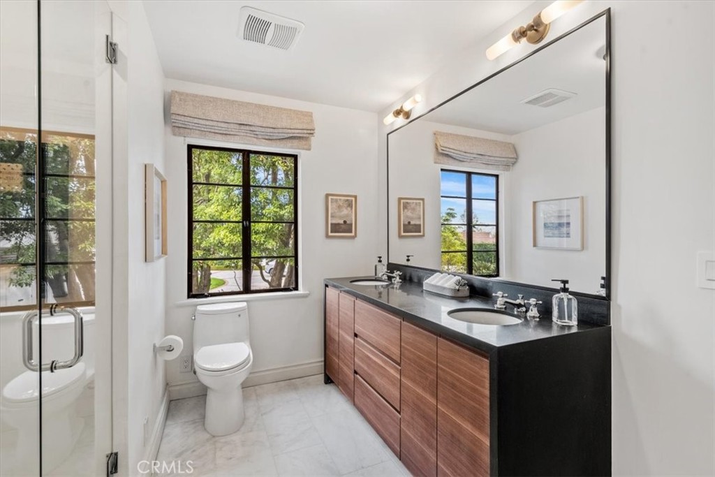 19 Wideloop Road Rolling Hills, CA 90274 - Photo 25 of 35 a bathroom with a granite countertop sink toilet and large mirror