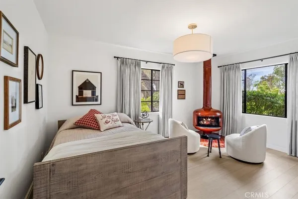 a bedroom with furniture and a window