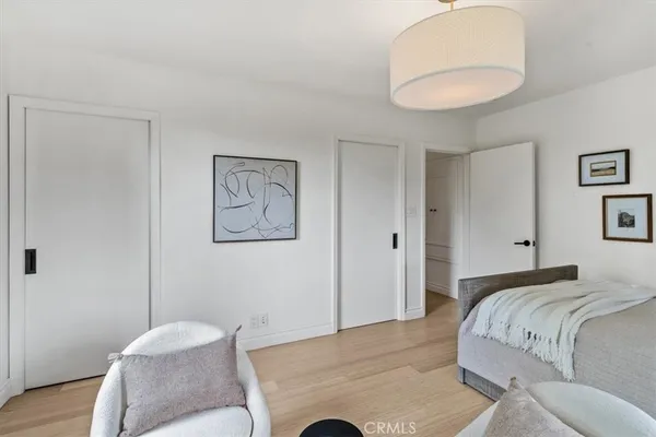 a bedroom with a bed and a couch